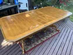 This is a used dining table with scuffs and dings that has a center leaf. Table top with leaf is 78” long X 40”...