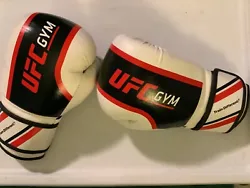 Rare UFC GYM preowned boxing training gloves. White and black. In good condition. NOTE: THERE ARE initials written in...