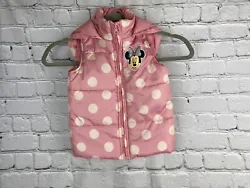 Stay warm and stylish with this adorable Minnie Mouse puffer vest from Disney. Made of 100% polyester, this sleeveless...