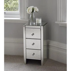 This mirrored glass bedside table with three drawers is sure to add sparkle to your bedroom. Three spacious drawers...