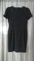 A classy, versatile dress in excellent, gently worn condition. Polyester/Acrylic/Rayon blend.