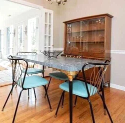 Great condition - Mid Century Modern formica table with insert and 4 chairs with turquoise seats. Black, gray, and gold...
