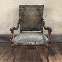 Louis XV Style Open Armchair with needlepoint upholstery. Seat height 17 1/2”. Signs of wear consistent with age and...