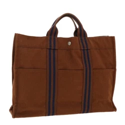 Style Tote Bag. Material Canvas. Color Brown / Navy. They have been used but you will find it tough to spot any marks....