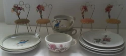 Features boy on a seesaw. Moss rose cup & saucers. These show signs of age & wear. Shows signs of age & wear. Marked on...
