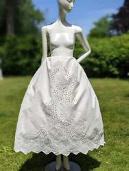 SEWN FULLY BY HAND. HAND STITCHED HIGHLY DETAILED FLORAL EYELET RUNS THROUGHOUT THE FRONT WITH THE EYELET ALL AROUND...