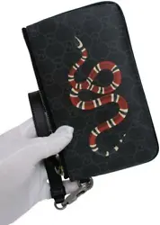 Black pouch from Gucci. Made of canvas. Zip fastening. Decorated with a printed logo pattern and a snake motif....