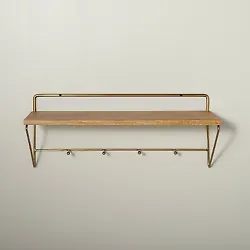 •24in wall shelf with hooks •Metal frame •Open wooden shelf •Brass finish  Description  Decorate and organize...