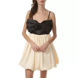 NWOT Oversized black bow front bodice mini dress. Smocked back panel. Voluminous cream bubble skirt. Two side pockets....