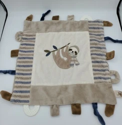 Soft velour,with a sloth center. Maison Chic lovey and teether. A little crinkle sound on a part of it.