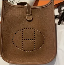 New HERMES Evelyne TPM Gold Leather Crossbody Bag Purse. Shipped with USPS Priority Mail.