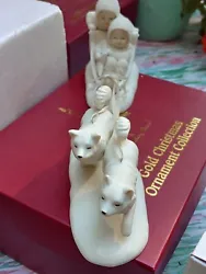 This Snowbabies figurine set from 1995 features a sled dog and two babies. It is a charming addition to any winter or...