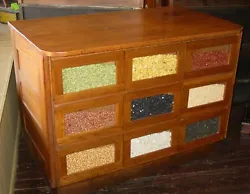 This is a nice 9 drawer oak bean or seed counter. You can display anything you like in the front glass area and use the...