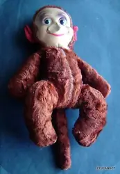 CONDITION: Monkey is in good condition for its age. Missing red felt hands and feet. Face has 2 areas that are pushed...