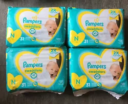 4 Pampers Swaddlers Newborn diapers 31ct packages 124 count total.