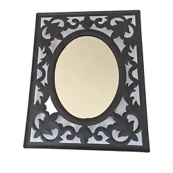 Black Wrought Metal Mirror. Oval mirror in matte black rectangular frame. Looks great, either wall mounted or in a...