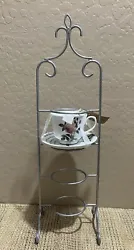 4-tier metal tea cup display stand; 23.75”Hx6.75”W (Tea cups not included.)These are silver powder coated not just...