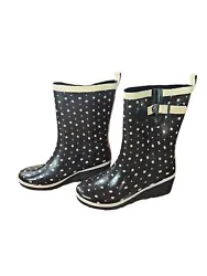 Add a pop of color to your rainy day attire with these black and pink polka dot wedge booties. These womens boots are...