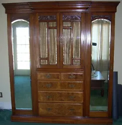 The finish is excellent and has Burled Walnut drawer faces - All the glass and mirrors are beveled - All the hardware...