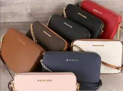 Our Jet Set crossbody bag is an instant classic. Gold-tone hardware. organization for your essentials. Details of the...