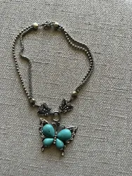 Add a touch of unique elegance to your outfit with this stunning Silver Tone & Turquoise Costume Butterfly Necklace....