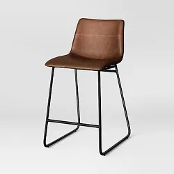 •Brown upholstered counter-height bar stool •Faux-leather seat and backrest •Armless design •Powder-coated...