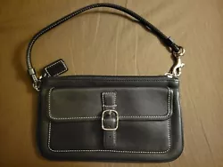 Authentic Coach handbag/purse.  Small and compact in design but very cute and stylish.  Measures 8