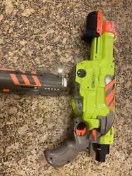 Nerf Vortex Lumitron Disc Gun. Batteries for the magazine are included and work really well. Comes with 12 white glow...