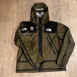 This olive jacket is a one-of-a-kind piece from the Supreme x The North Face Summit Series collaboration. It features...