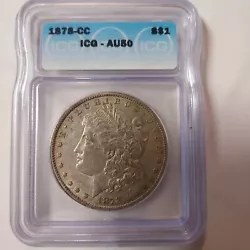 This 1878 CC Morgan Silver Dollar is a highly sought after coin for collectors. With a grade of AU50 by ICG, it is...