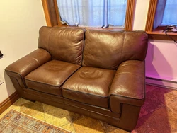 loveseat sofa used. Some scratches and rubbed leather. Still in great condition.