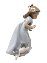 This vintage Lladro NAO figurine depicts a girl with her beloved puppy. Crafted in 1987, this licensed reproduction...