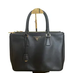 This PRADA Galleria Tote is a stylish and elegant bag that is perfect for any occasion. It is made of high-quality...