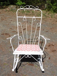 Has wooden seat under removable cushion. Any imperfections that have occurred only add to the charm and uniqueness.