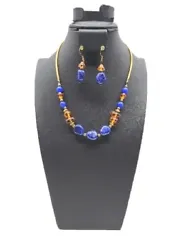 This vintage jewelry set exudes elegance with its beautiful blue and amber-tone design. The set includes a necklace and...