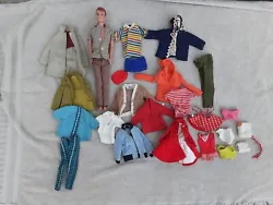 THIS IS A VINTAGE RED HEAD ALLAN DOLL INCLUDING 25 PIECES KEN, ALLAN, AND SKIPPER CLOTHING OUTFITS.  ALLAN IS MARKED...