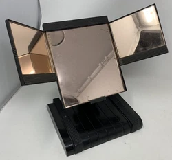 It’s about 9-3/4” tall at its tallest, 12” across, and 7” front to back. The big mirror is about 6”x6-1/2”...