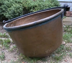 Iron handle when extended makes top of handle to bottom of cauldron approx 29