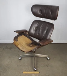 This has been partially restored but still needs upholstered to finish it up. I am not sure if this is an actual Eames...