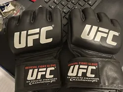 This UFC official fight glove LARGE 2007 +Bad Boy Hand Wraps See Photos Like New.  I think I hit the heavy bag once or...