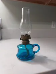 For sale, I have an antique blue mini oil lamp. The oil lamp has no chips or cracks. The burner is in working...