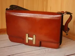 Classic vintage unisex clutch by Hermes. Firm leather surface and inside. Fittings brass. Good condition. Cracks and...