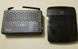 Cisco E1200 Modem. Both in working condition. (D-Link has broken antennae).