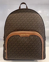 Made of Signature PVC with Zip pocket detail on front. Front zip pocket. One inside zip pocket. 01 inside open pocket....