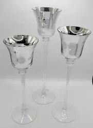 Add some sparkle to your home decor with this beautiful set of 3 tall glass candle holders. The silver glass holders...