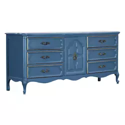 This dresser is professionally refinished in light blue with gold painted accents and satin finish.