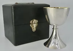 Traveling chalice resting on a conical circular base in silvered bronze engraved with a cross, the cup is in silver,...