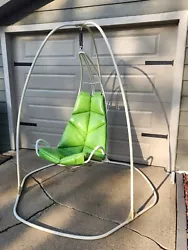 This vintage mid-century modern atomic patio hanging swing chair by Homecrest is a true gem for any antique furniture...
