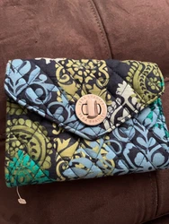Vibrant blue, teal, navy and green colors. Excellent condition. Plenary of storage for credit cards, zipper storage and...