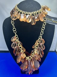 Traci Lynn Fashion Necklace & Bracelet With Clear Smokey Amber Colored Beads.